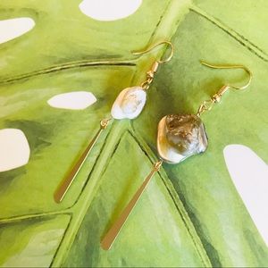 Natural shell and gold irregular long earrings.